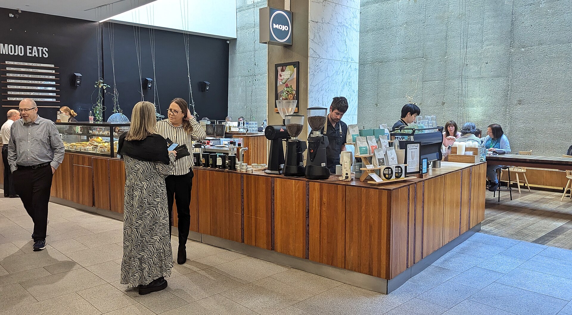 Espresso being poured at a coffee shop counter