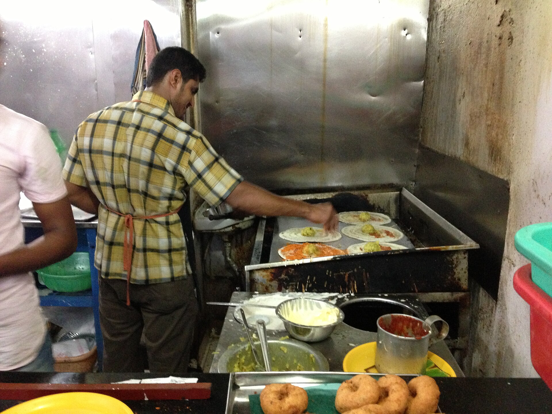 A cook working the line in a restaurant kitchen